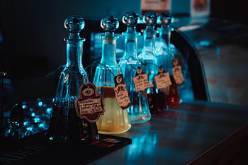 clear glass vases, bottle, glass, condiments, table, lights, blue, bokeh, blur, tags, label