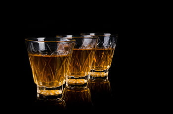 three, clear, crystal-cut rock glasses, brown, liquid, bar, liquor, barman, pouring, close-up, preparation