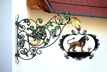 black, green, wrought, iron wall candle holder, lion, shield, restaurant, blacksmithing, sideboard, coat of arms, advertising sign