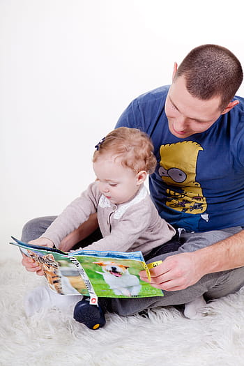 man, girl, sitting, white, fur textile, reading book, child, family, daughter, dad, father