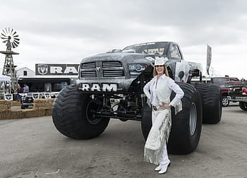 smiling, woman, standing, front, black, dodge, ram, 1500, single, cab pickup truck, daytime