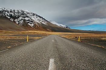 asphalt road, mountain, gray, concrete, road, clouds, highway, pavement, grass, field, nature