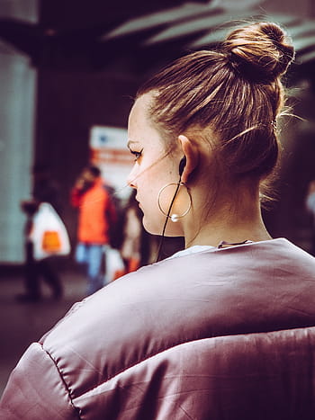 close-up photography, woman, wearing, pink, top, inside, room, people, earphone, earrings, hairstyle