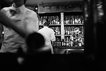man, white, coat, grayscale photography, bar, lounge, cocktail, alcohol, glass, restaurant, club