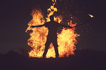 silhouette, man, standing, front, bone fire, nighttime, next, bonfire, night, fire, flame