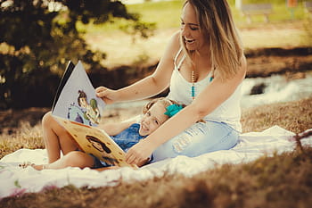 woman, white, spaghetti, strap, top, holding, book, mother and daughter, mother, daughter, blue