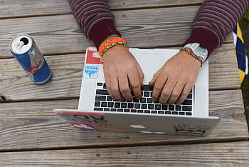 person, using, silver macbook, macbook, white, red, bull, can, hand, laptop, computer