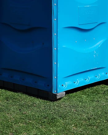 blue, loohire metal machine, green, grass, sunny, day, cubicle, outdoors, garbage