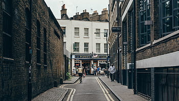 road, street, sidewalk, cobblestone, bricks, buildings, walls, pedestrians, people, walking, stores