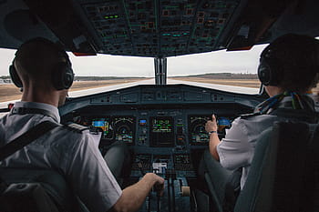 two, pilots, sitting, cockpit seats, cockpit, pilot, people, men, airplane, travel, transportation