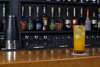 drink, cocktail, bar, bartender, mixed drink, alcoholic beverage, bar counter, bar setup, bar scene, bar drink, bar atmosphere