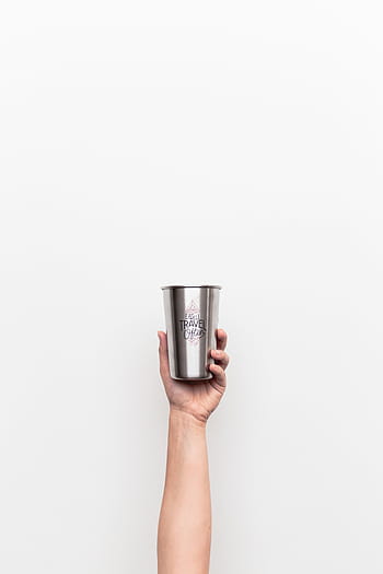 person, holding, gray, travel, stainless, steel drinking cup, white, background, bottle, mug, cup