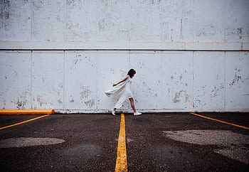 building, wall, people, white, dress, girl, woman, female, walking, alone, sad