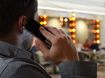 man, holding, smartphone, wearing, dress shirt, man talking on the phone, city, communication, telephone, talking, cellphone