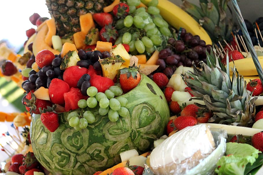 fruit arrangement, table, fruit, colorful, food, presentation, melon, grapes, pineapple, strawberries, cheese