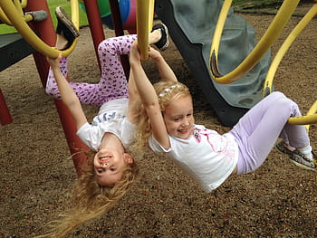 two, girls, hanging, holding, yellow, bars, play, ground, playground, park, equipment