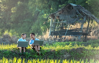 two, toddlers, sitting, grass field, holding, gray, laptops, children, laugh, study of, laptop
