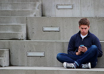 man, blue, jacket, sitting, concrete, stair, texting, boy, teenager, outdoor, one man only