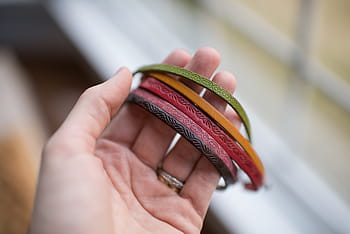 person, holding, assorted-color bracelets, bracelet, accessory, people, hand, ring, married, engaged, human hand