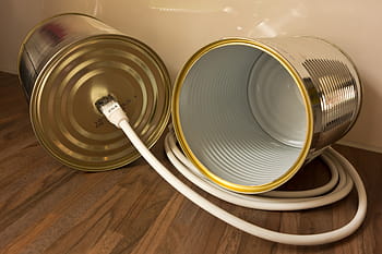 gray, tin, telephone, toy, brown, wooden, parquet floor, canned phone, voice over ip, box, cable