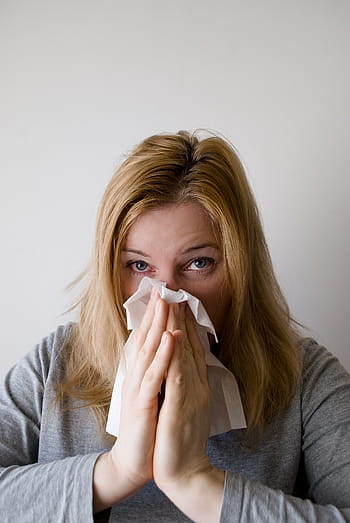 woman, sneezing, white, tissue paper, blow, blowing, nose, hand chief, grey, blond, female
