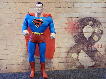 superman figure, front, brick wall, superman, superhero, toy, hero, man, costume, cartoon, character