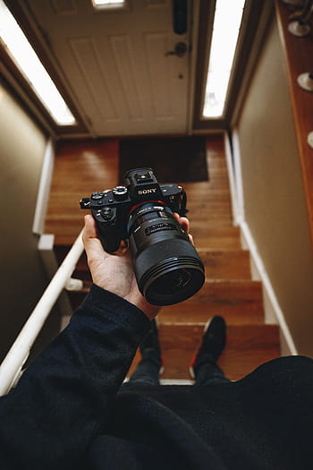 person, holding, black, sony dslr camera, sony, dslr, camera, lens, photography, blur, stair