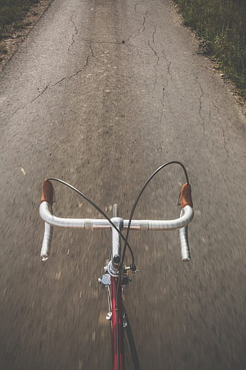 red, road bike, parked, upright, gray, concrete, road, bike, bicycle, pavement, ground