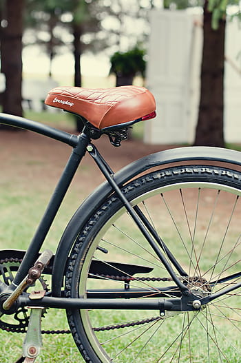 black fixed-gear bike, selective, focus, black, bicycle, brown, leather, seat, park, near, leaf