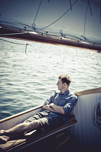 man, sitting, bench, chair, boat, sailboat, boating, lake, water, guy, shorts