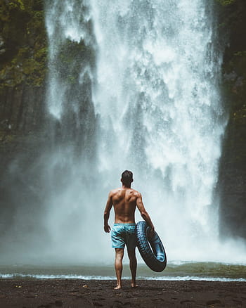 man, holding, swim, ring, walking, towards, waterfalls, water, waterfall, motion, outdoors