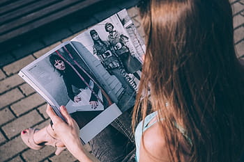 person reading entertainment magazine, people, woman, girl, brown, hair, reading, magazine
