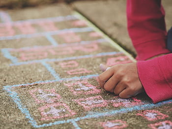 person, wearing, red, long-sleeved, top, lying, green, area, rug, chalk, pavement