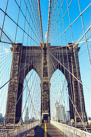 person, walking, brown, concrete, suspension bridge, daytime, architecture, building, infrastructure, structure, establishment