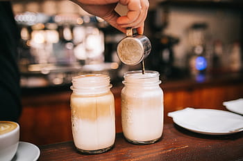 person, pouring, liquid, two, clear, glass mason jars, glass, jar, drink, bar, barista