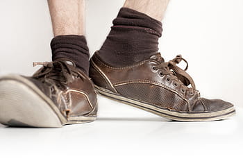 person, wearing, brown, leather low-top shoes, socks, old shoes, shoes, sneaker, leather, foot, pair
