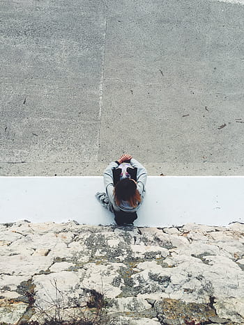 woman, wearing, gray, long-sleeved, shirt, sitting, people, sit, fashion, floor, rocks