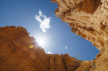 worms eye view photo, brown, canyon, nature, landscape, mountain, clouds, sky, sun, travel, adventure