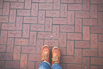 person, wearing, brown, leather shoes, leather, shoe, footwear, jeans, floor, outdoor, outside