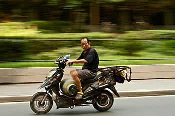 man riding motorcycle, guy, man, motorcycle, riding, road, gas, tank, trees, grass, way