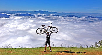 person, carrying, white, bicycle, Mountain Bike, Wheel, bike, cycling, sports equipment, wheels, bicycles