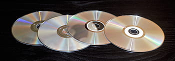 four compact discs, discs, cd, dvd, software, digital, cd-rom, dvd-rom, rom, blu-ray, technology
