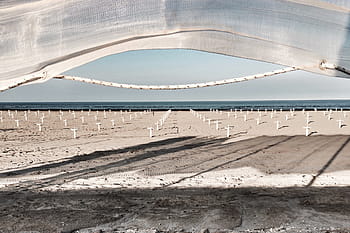 cemetery during daytime, white, cross, cemetery, day, time, sea, ocean, water, wave, nature